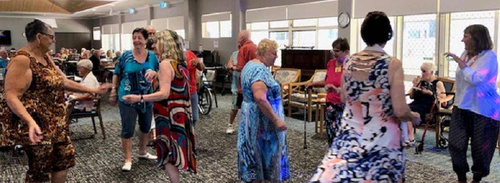 A group of retirement village residents dancing