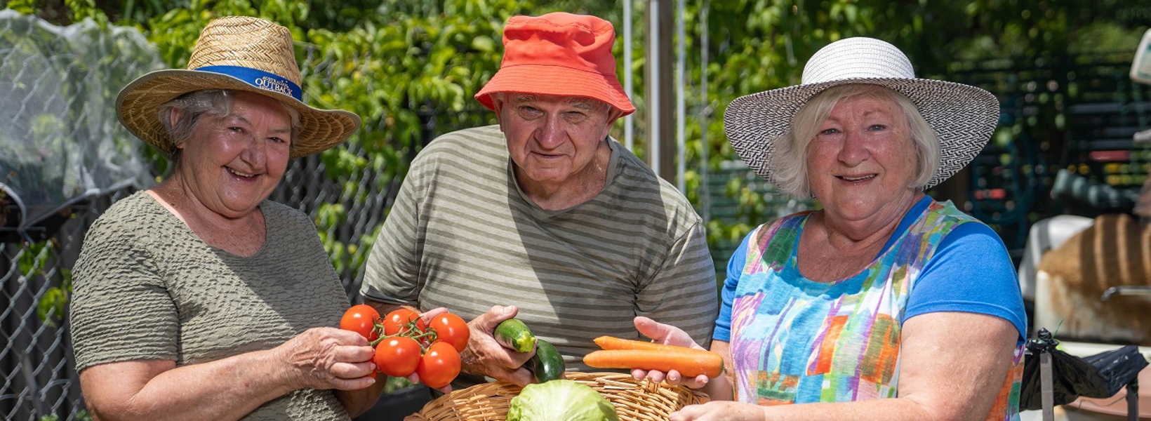 Rowes Bay residents in the community garden